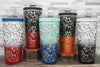 Ice Shaker Flex Bottle laser engraved with lily pattern displayed as a group in all of the two-tone finishes: red/white, red/black, navy/mint, orange/black, and black/white.