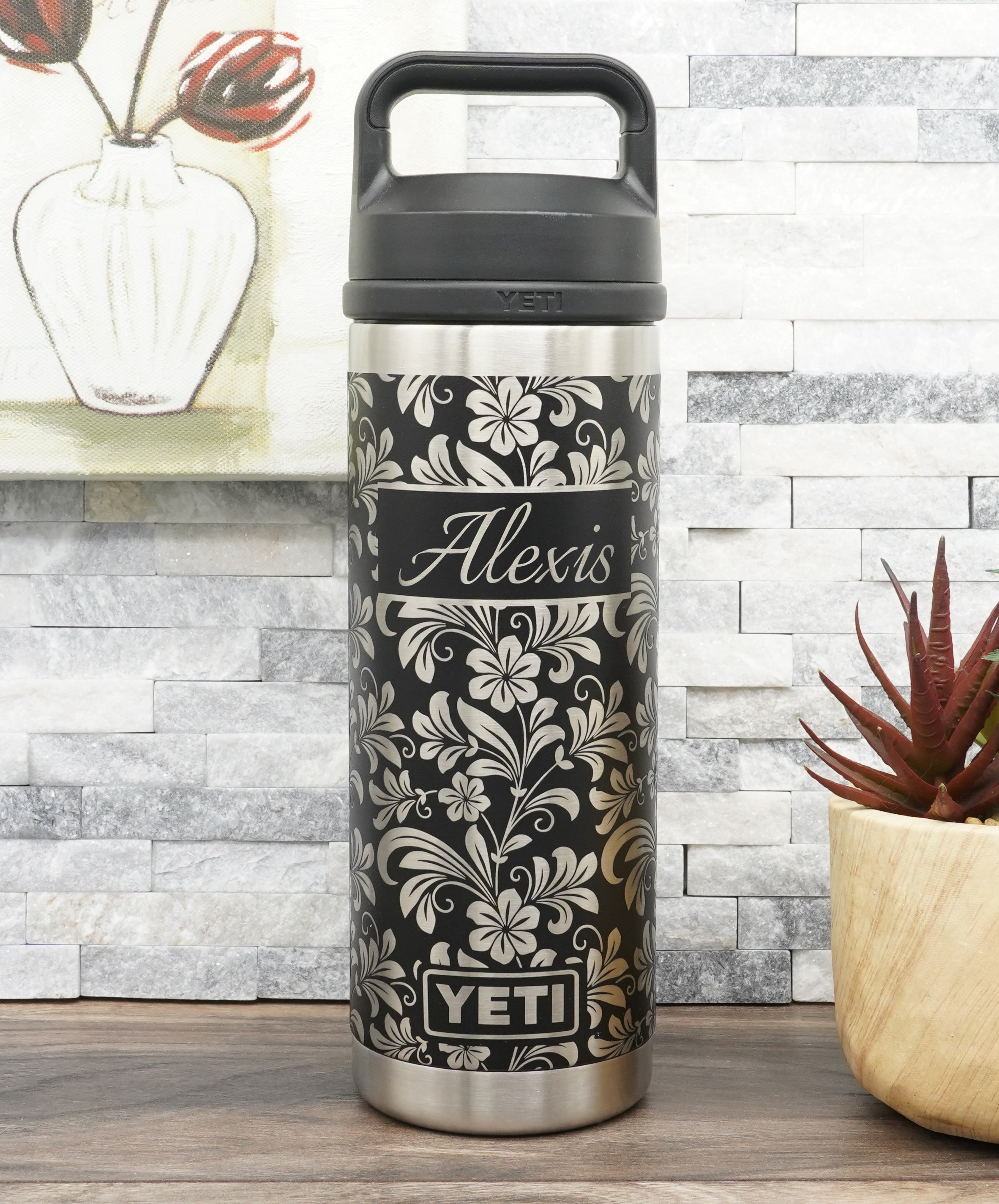 26oz YETI water bottle laser engraved with hibiscus flower wrap-around design.