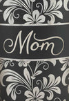 Zoom-in detail for laser engraved hibiscus flower pattern with "Mom" added.