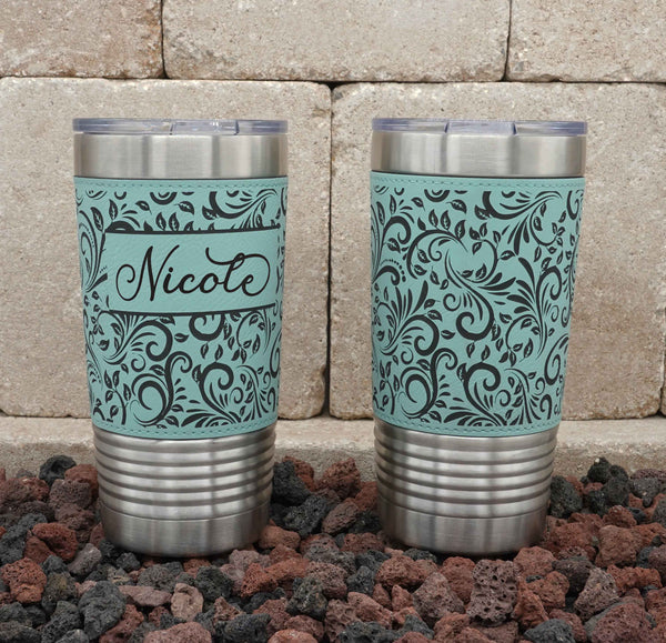 Leatherette-wrapped insulated stainless steel tumbler laser-engraved with tooled leather pattern.