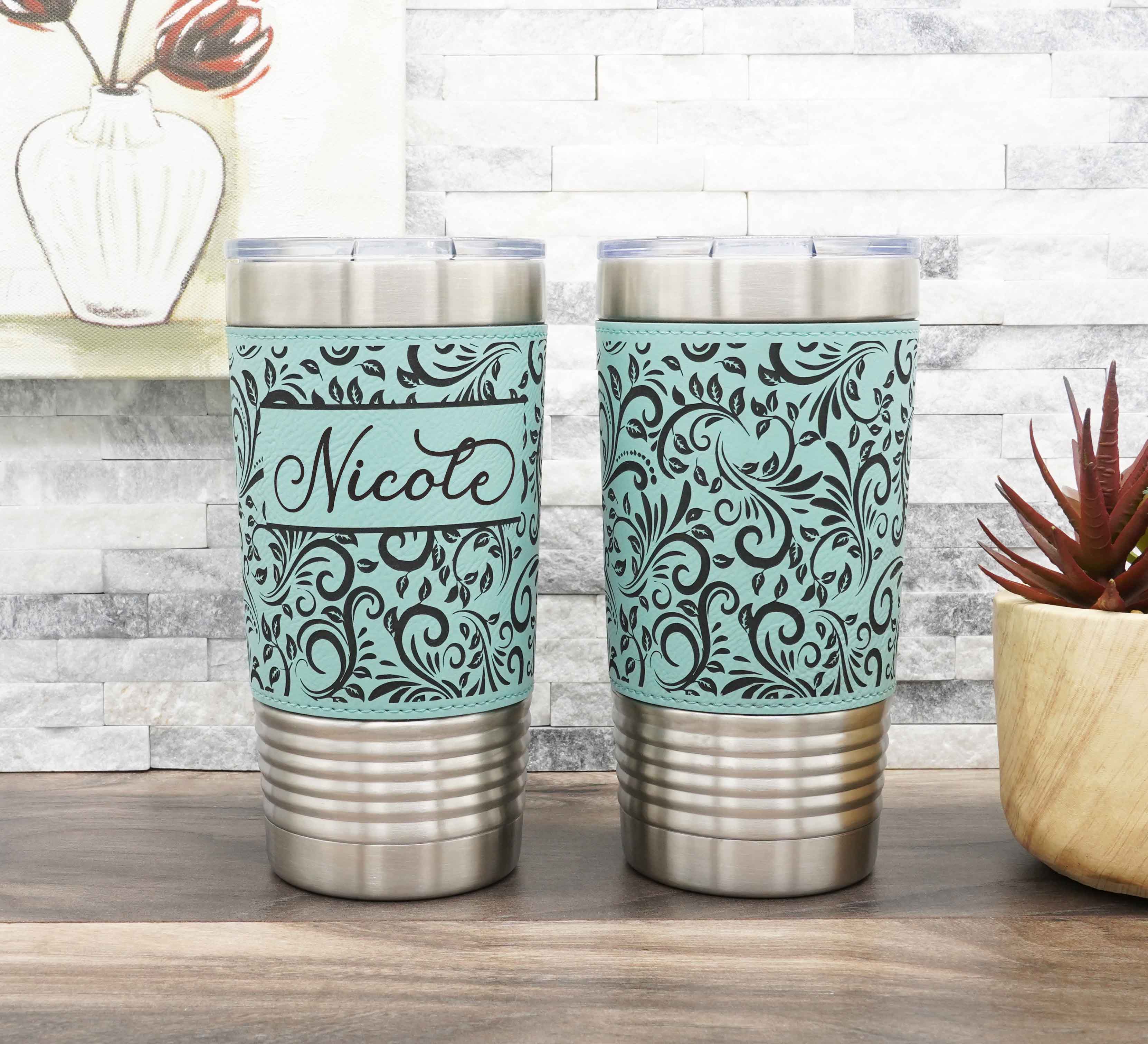 Leatherette-wrapped insulated stainless steel tumbler laser-engraved with tooled leather pattern.