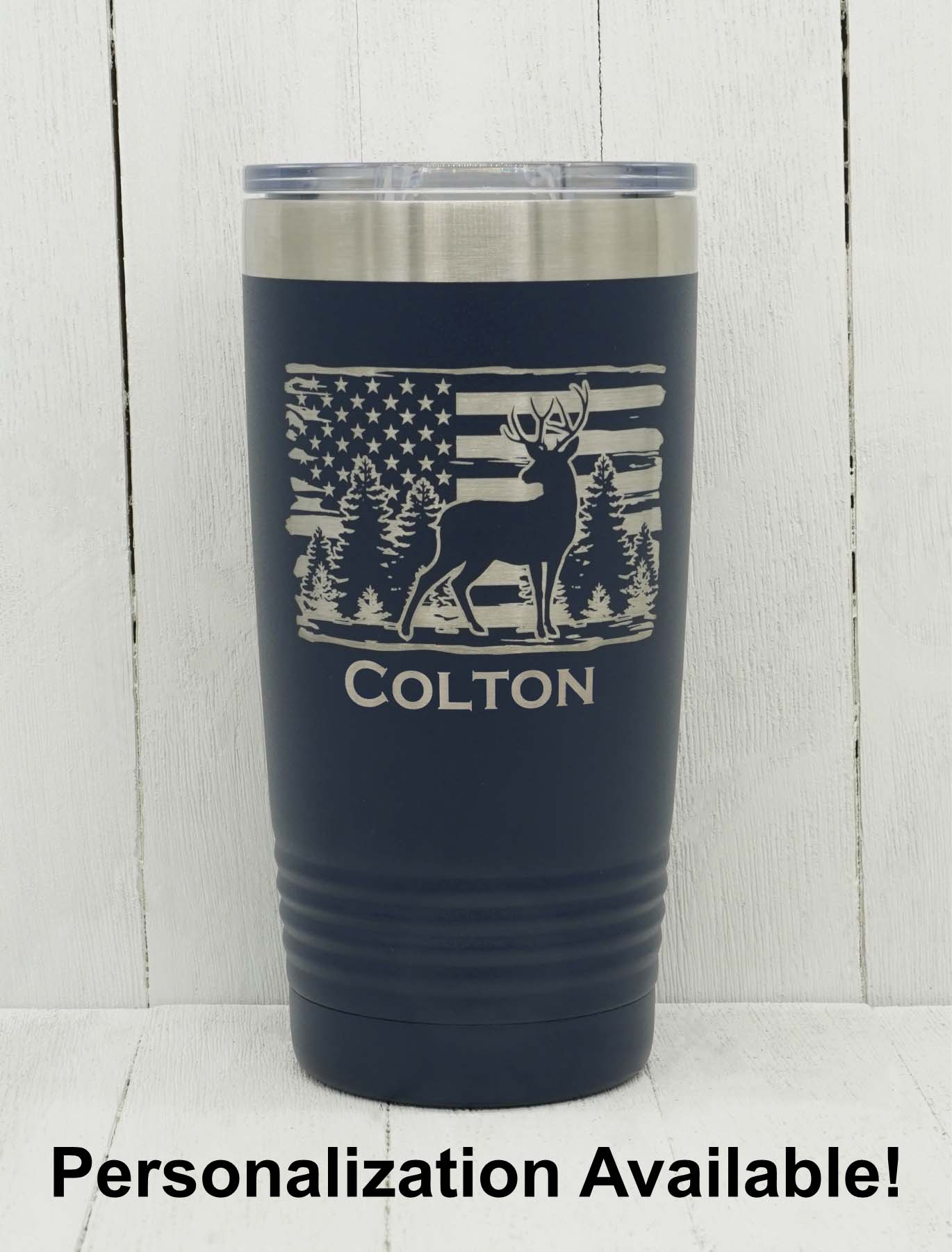 Laser engraved deer among trees with distressed American flag shown with personalized name engraved to show example of what personalization looks like