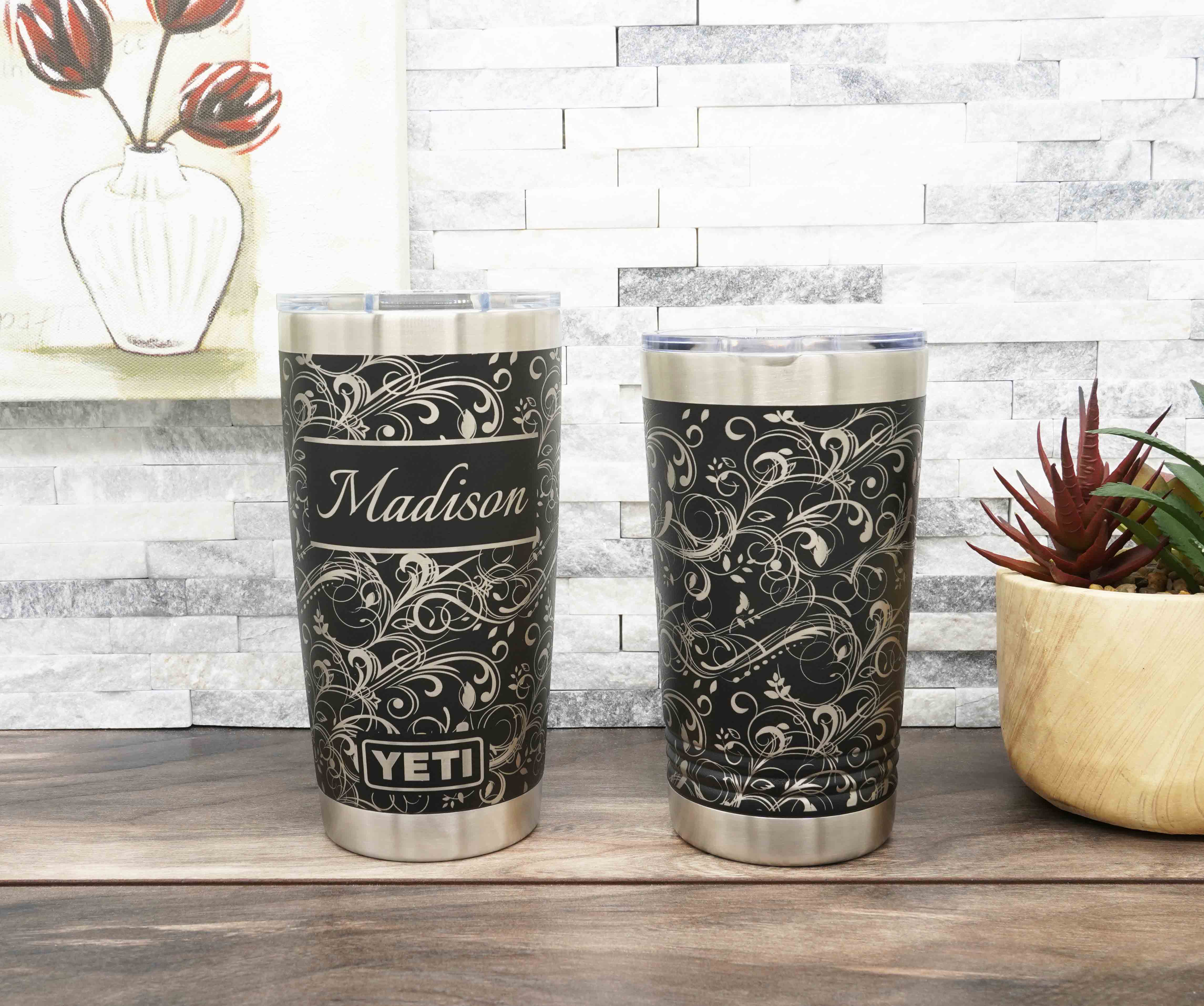 Yeti and Polar Camel tumblers laser engraved all the way around the tumbler with a fancy flourish pattern for a 360 degree full wrap around design. Personalization optional.