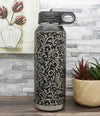 Polar Camel water bottles laser-engraved with tooled leather pattern full wrap-around design.