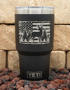 30oz black Yeti tumbler laser engraved with deer standing among trees with distressed American flag